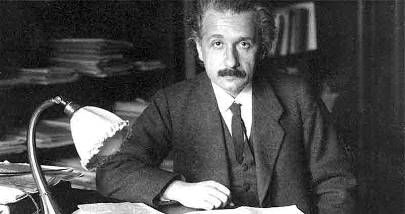 Albert Einstein at his desk