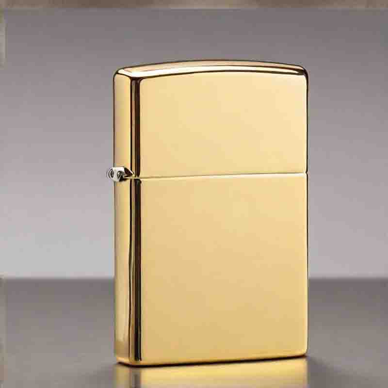 A luxurious gold Zippo lighter placed on a table.